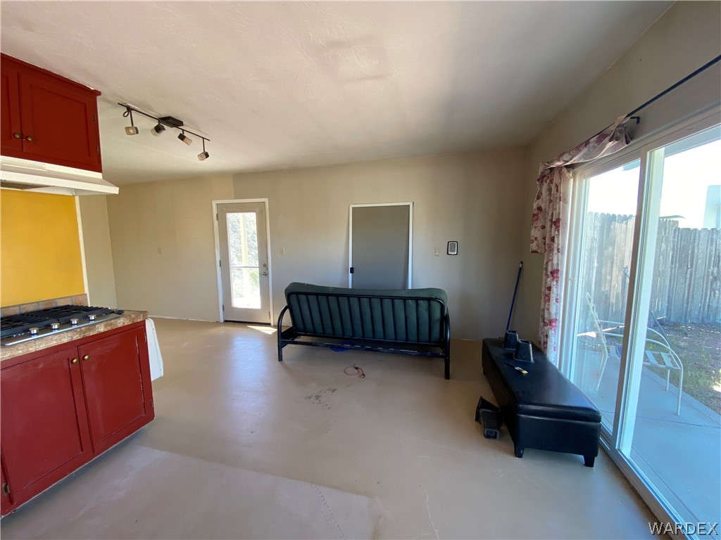 9095 Elliott Ridge Road Kingman, AZ 86401 - Photo 9 of 54 a view of a room with a floor to ceiling window and a flat screen tv