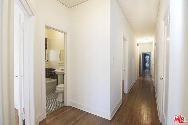 a view of a bathroom from a hallway