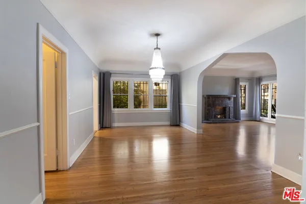 a view of an entryway with wooden floor and a window