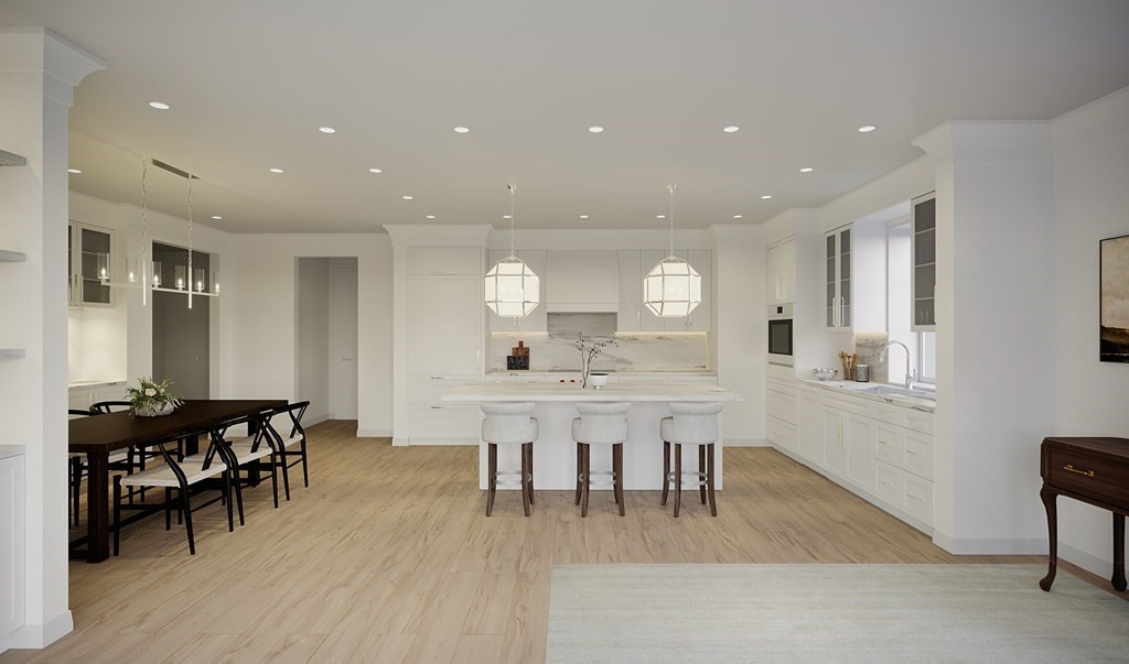 148 Weston Road, Unit 108 Wellesley, MA 02482 - Photo 4 of 11 a view of a dining room with furniture and wooden floor