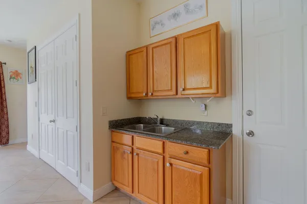 a kitchen with stainless steel appliances granite countertop cabinets and window