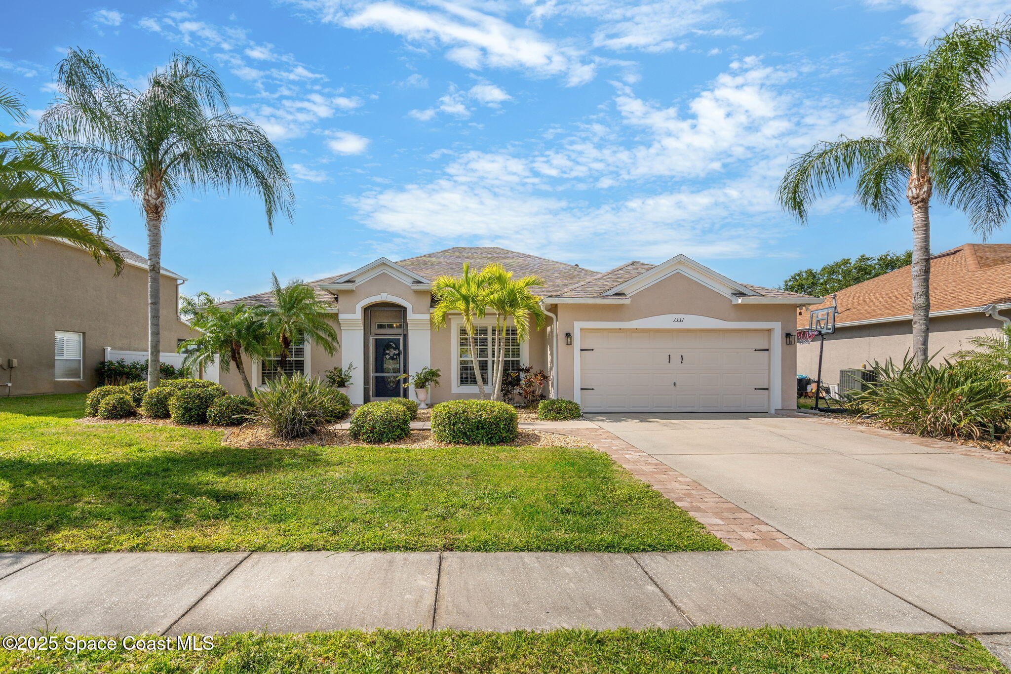 1331 Enclave Drive Rockledge, FL 32955 - Photo 1 of 43 a front view of a house with garden