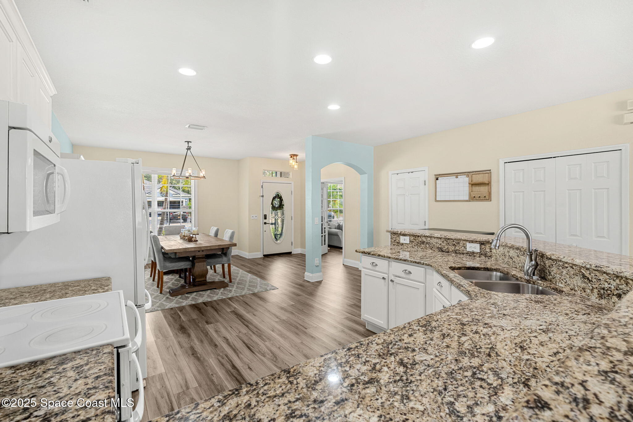 1331 Enclave Drive Rockledge, FL 32955 - Photo 13 of 43 a living room with furniture and a wooden floor