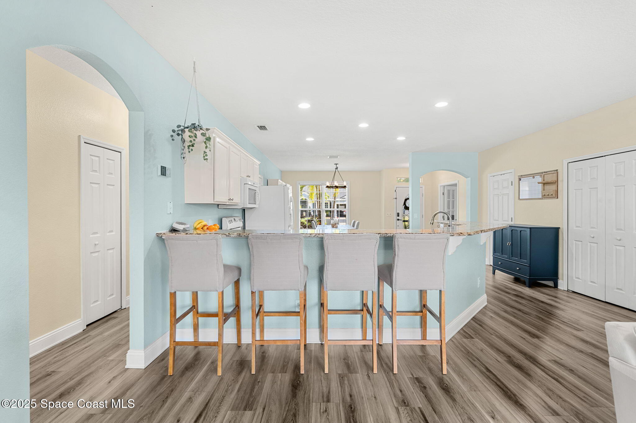 1331 Enclave Drive Rockledge, FL 32955 - Photo 14 of 43 a view of a dining room with furniture and wooden floor