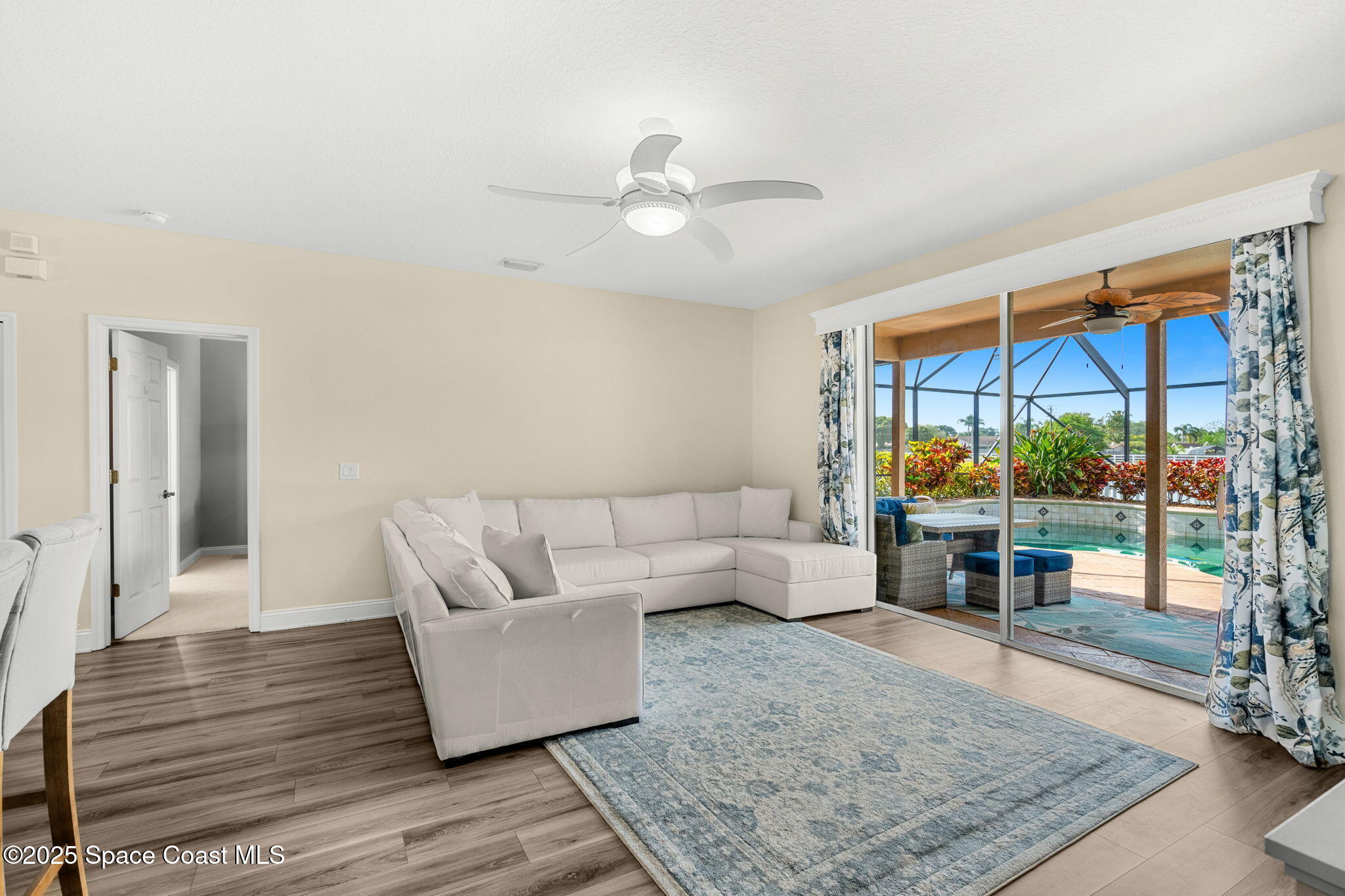 1331 Enclave Drive Rockledge, FL 32955 - Photo 16 of 43 a living room with furniture and a large window