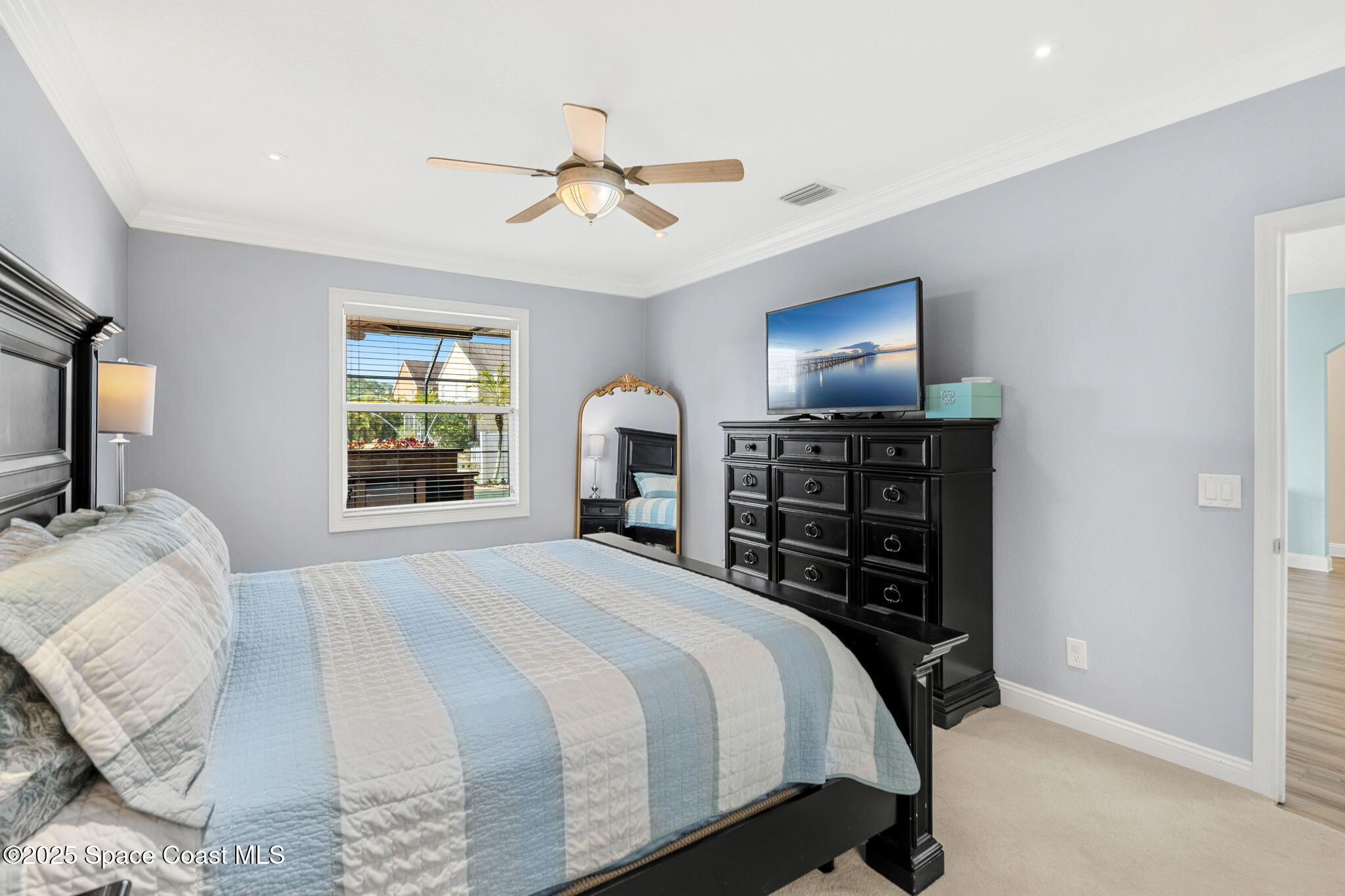 1331 Enclave Drive Rockledge, FL 32955 - Photo 18 of 43 a bedroom with a bed and a tv