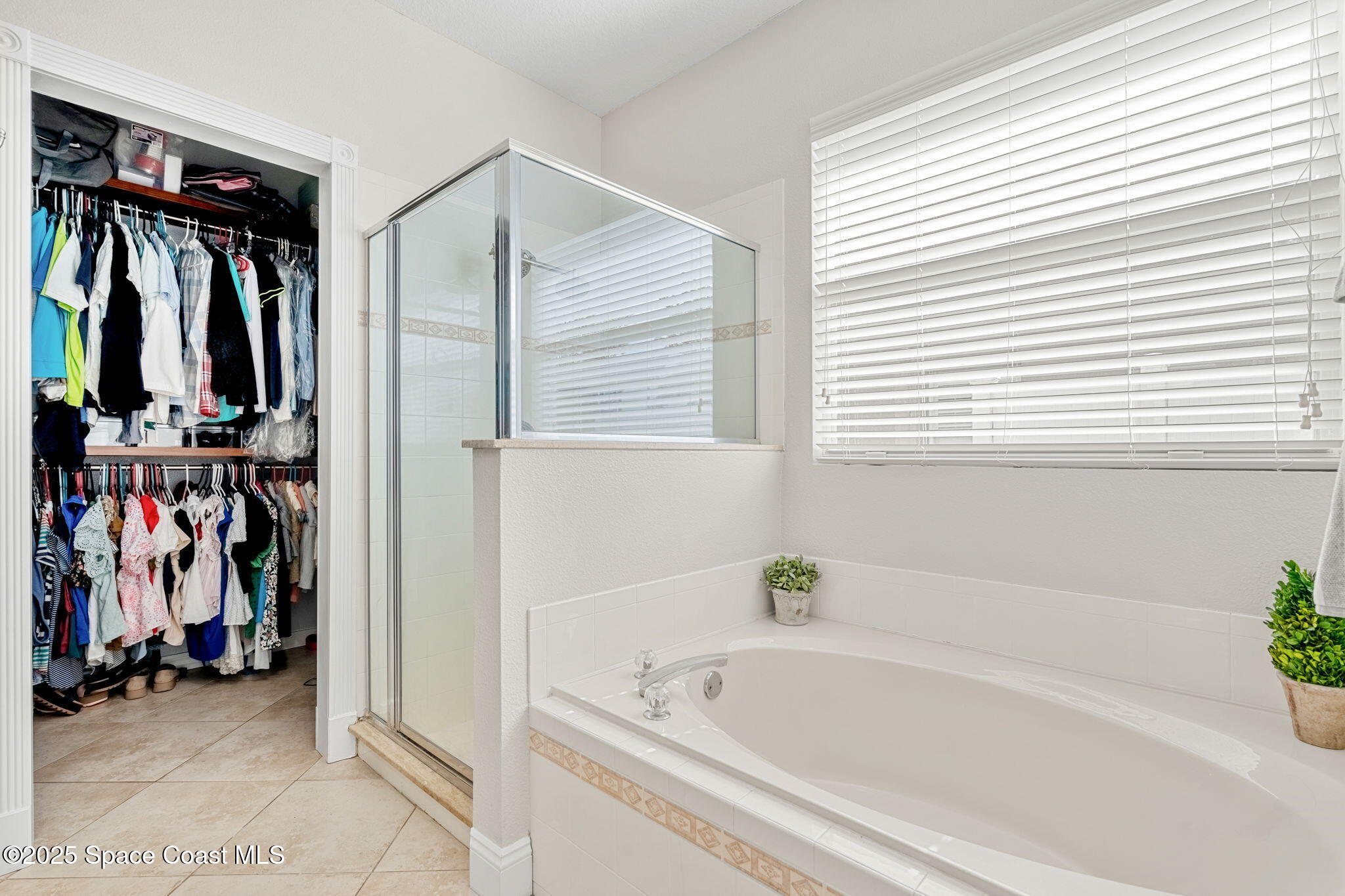 1331 Enclave Drive Rockledge, FL 32955 - Photo 20 of 43 a bathroom with a bathtub and a shower