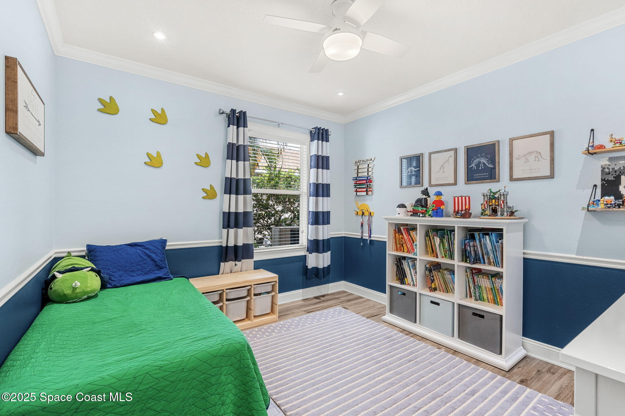 1331 Enclave Drive Rockledge, FL 32955 - Photo 21 of 43 a living room with furniture and a book shelf