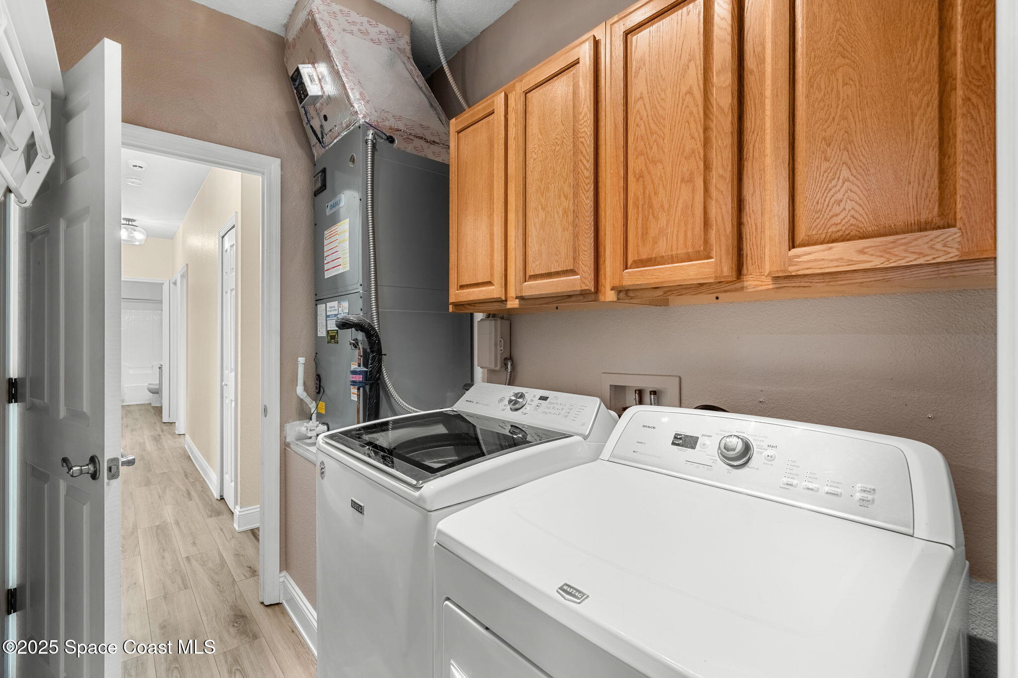 1331 Enclave Drive Rockledge, FL 32955 - Photo 25 of 43 a utility room with dryer and washer