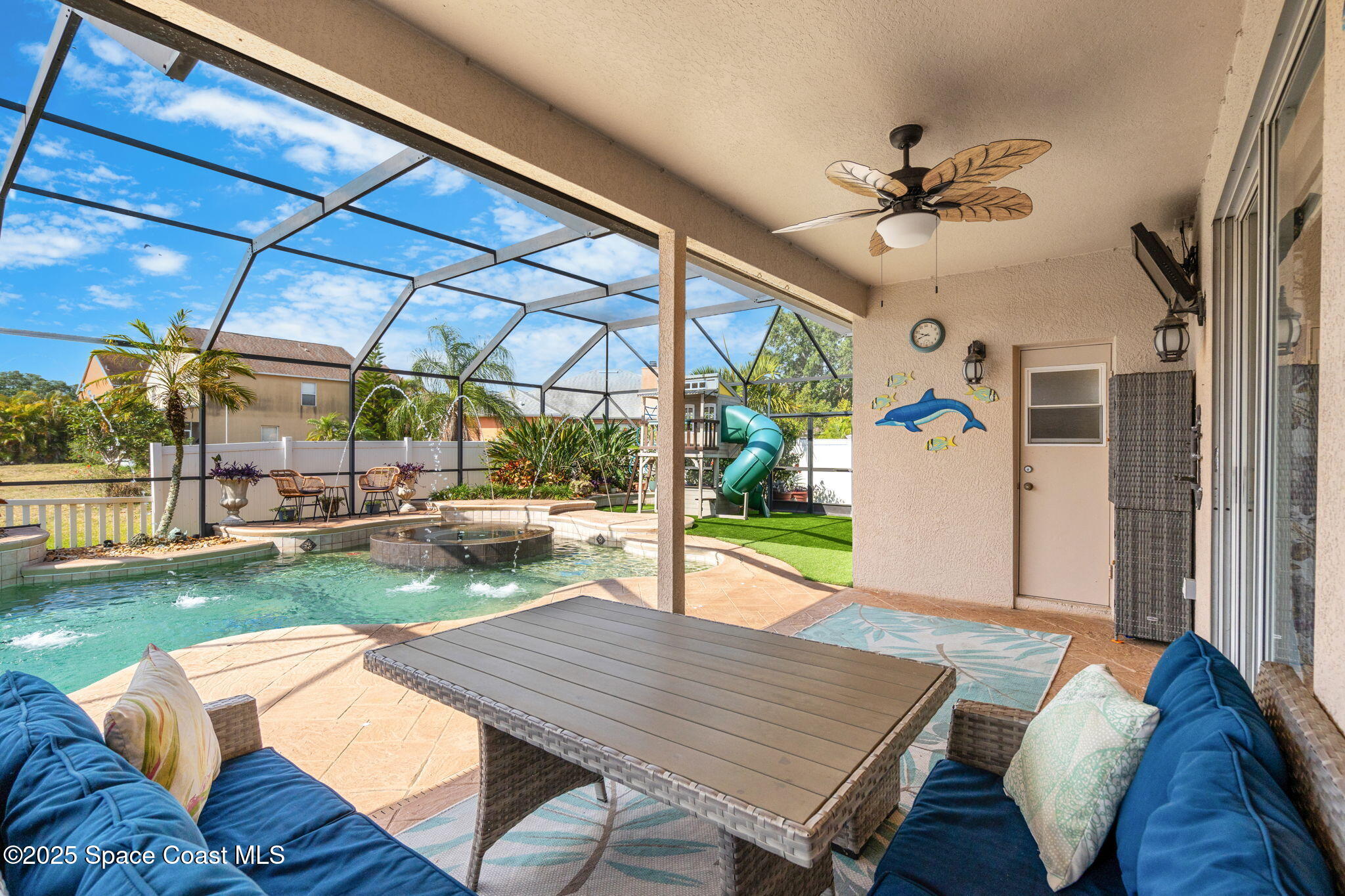 1331 Enclave Drive Rockledge, FL 32955 - Photo 26 of 43 a view of a patio with a table chairs and a backyard