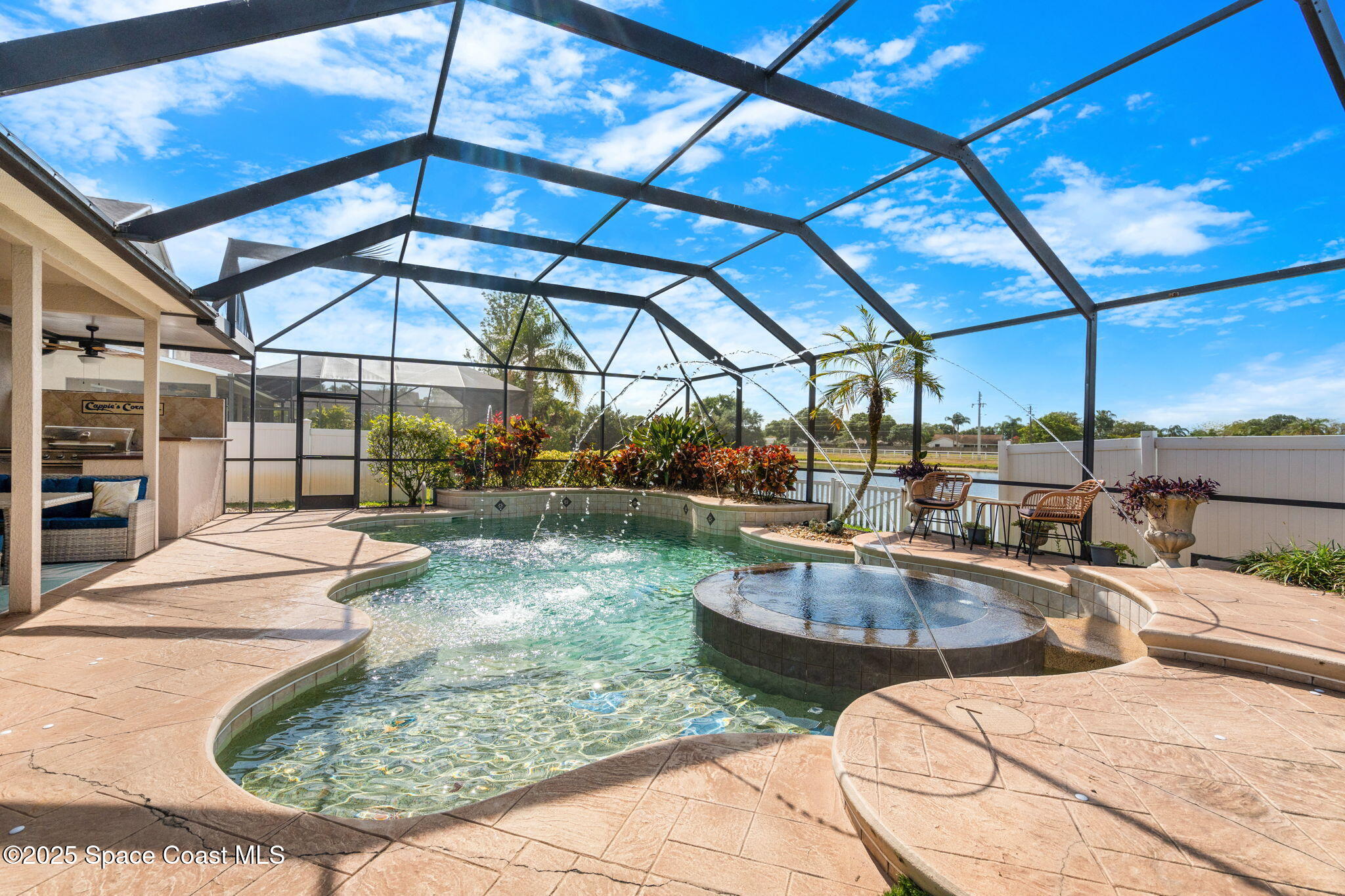 1331 Enclave Drive Rockledge, FL 32955 - Photo 28 of 43 a view of a swimming pool with a patio