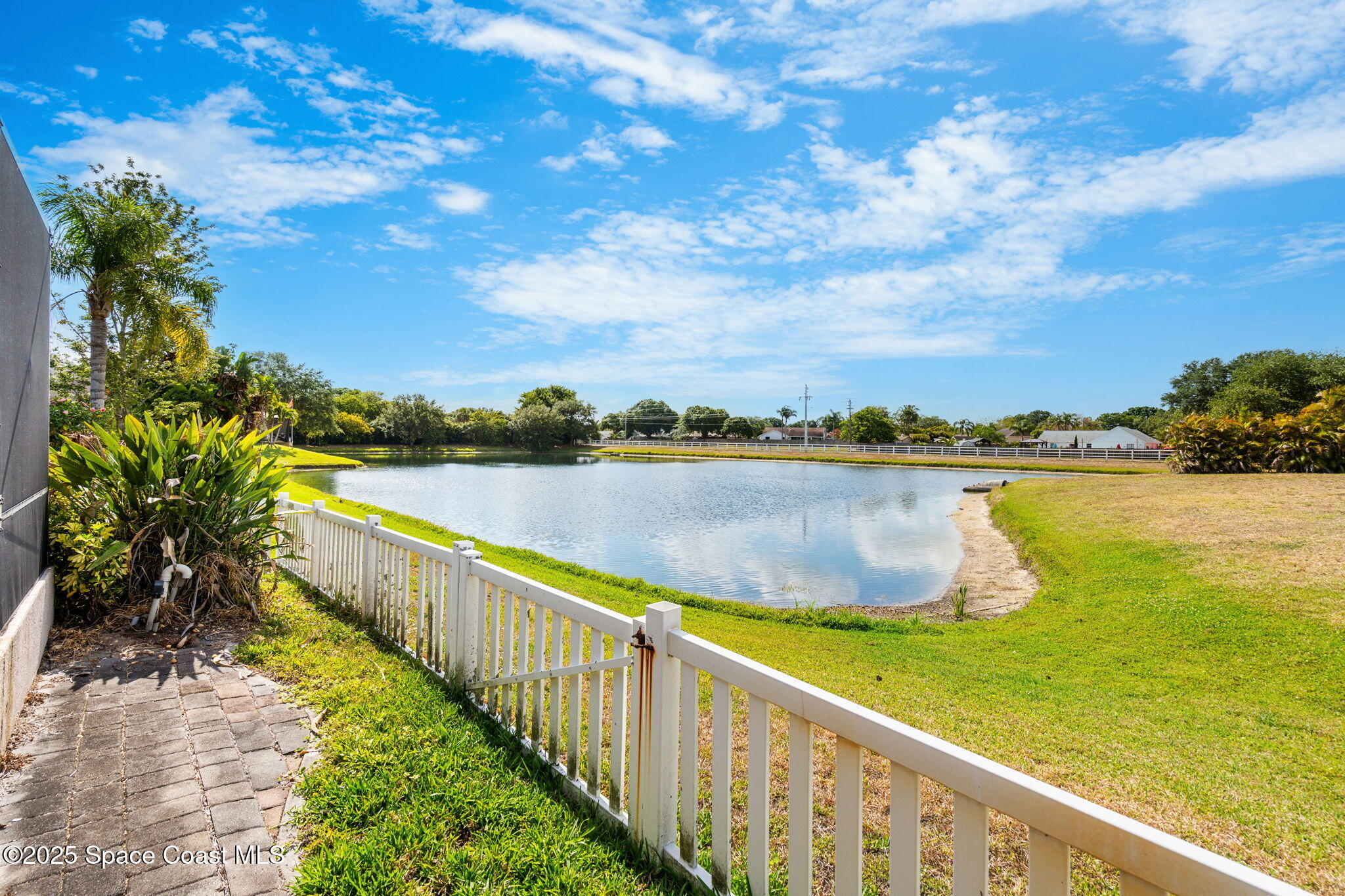 1331 Enclave Drive Rockledge, FL 32955 - Photo 35 of 43 a view of a lake with a city view