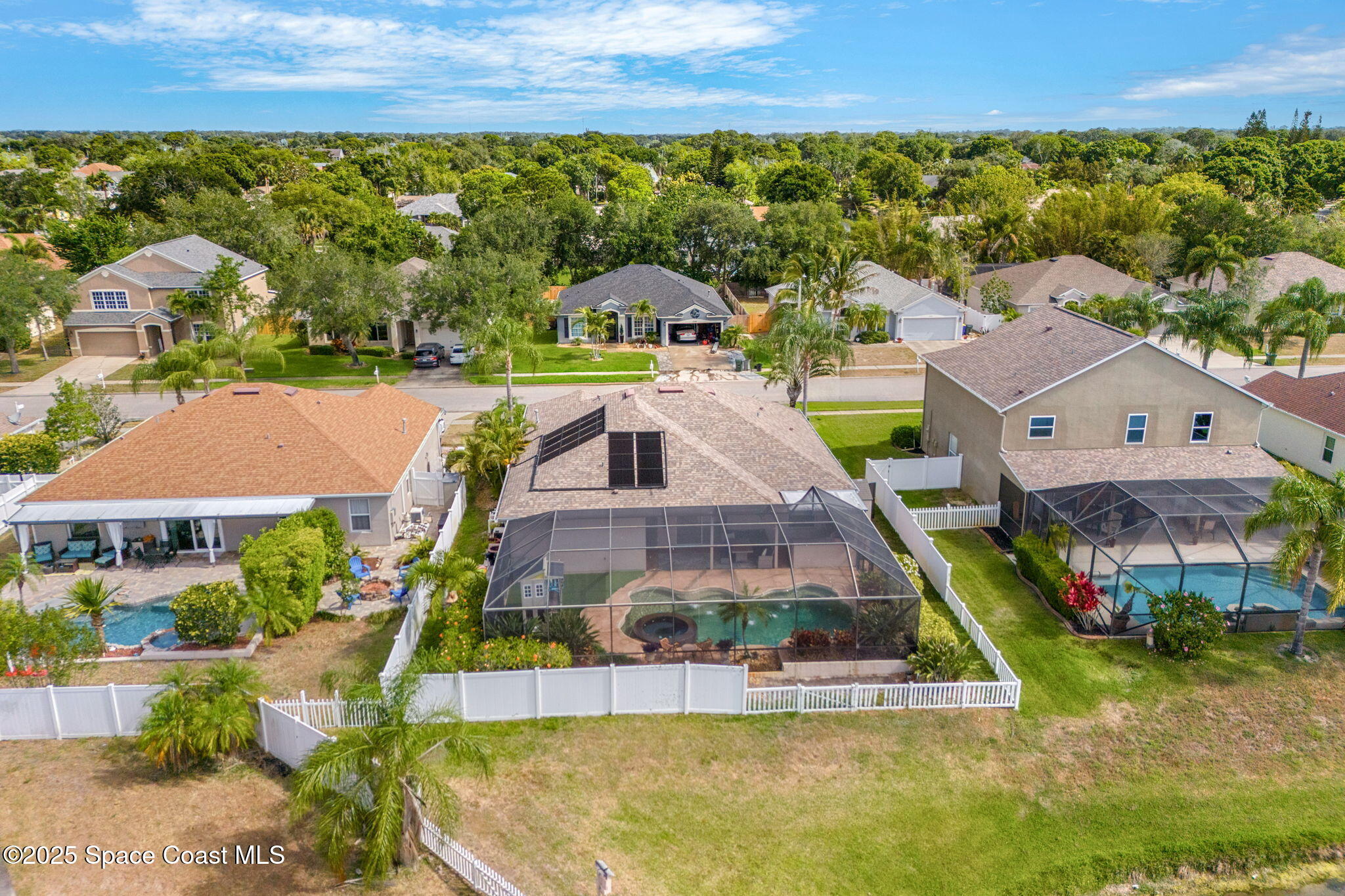 1331 Enclave Drive Rockledge, FL 32955 - Photo 38 of 43 an aerial view of multiple houses with a swimming pool