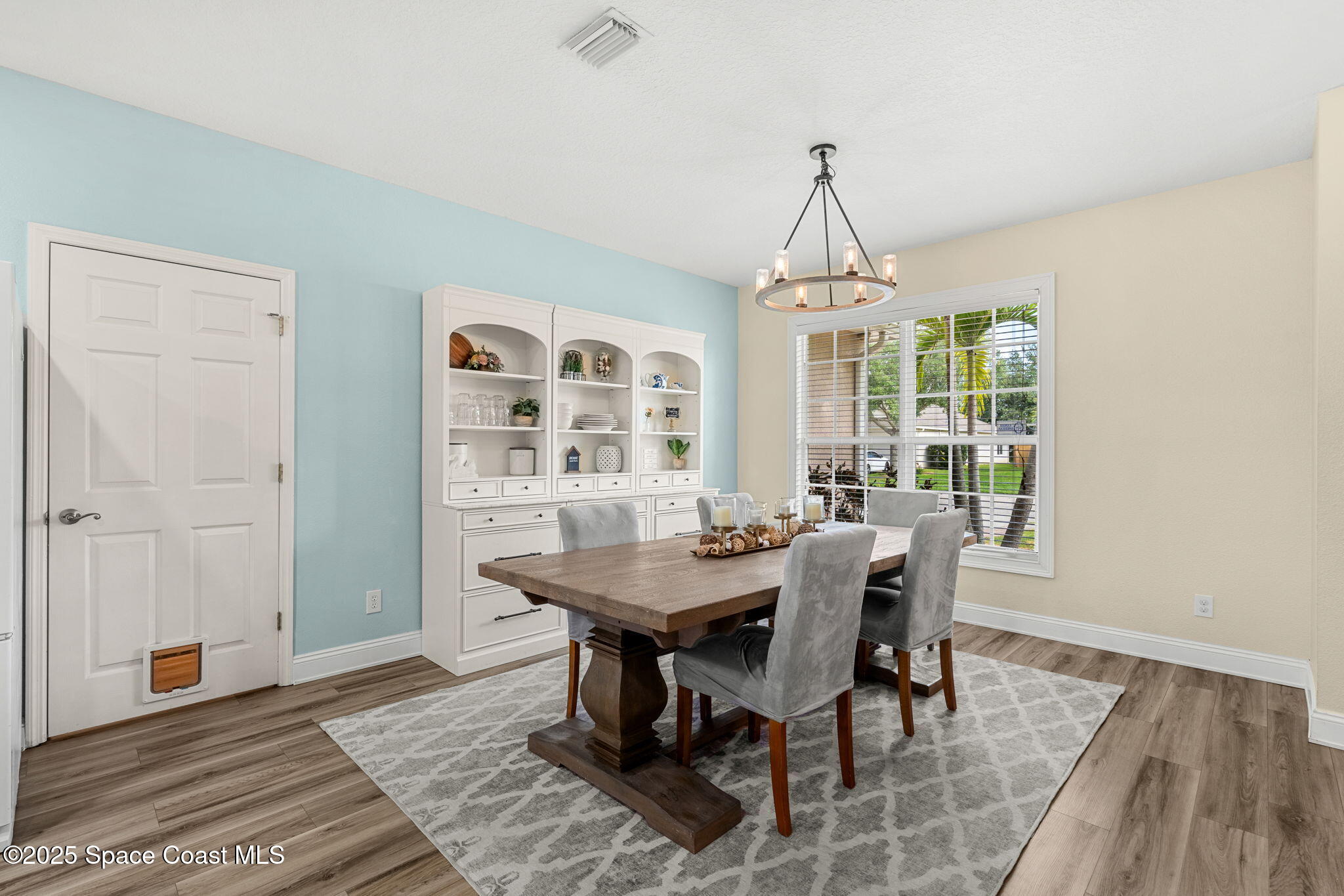 1331 Enclave Drive Rockledge, FL 32955 - Photo 7 of 43 a view of a dining room with furniture window and wooden floor