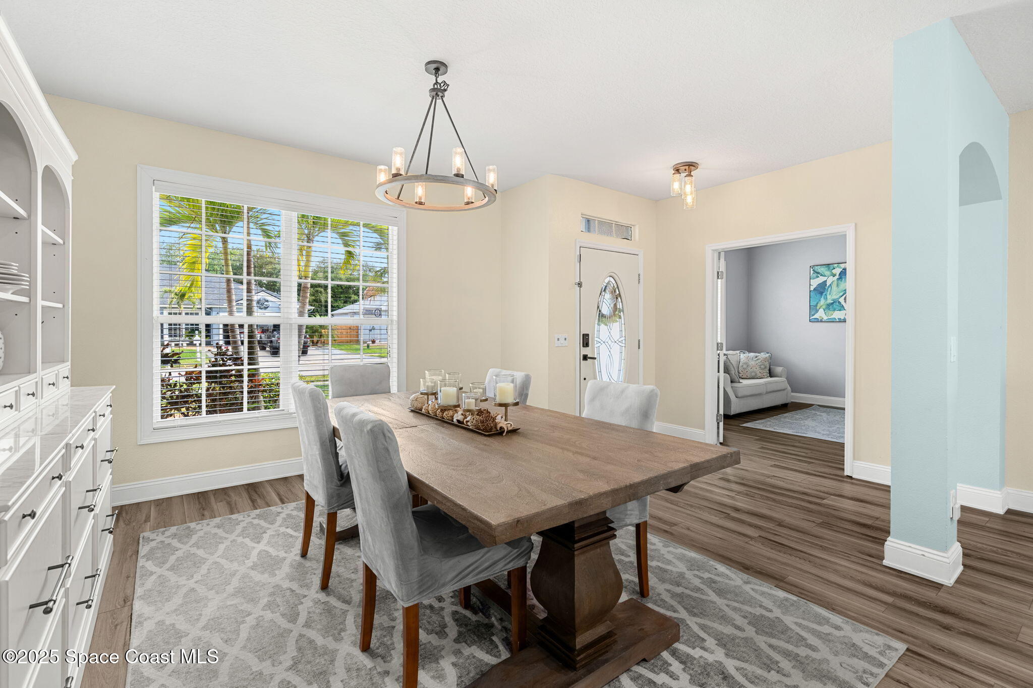 1331 Enclave Drive Rockledge, FL 32955 - Photo 8 of 43 a view of a dining room with furniture window and wooden floor