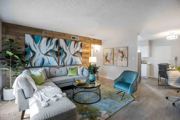 a living room with furniture and a rug