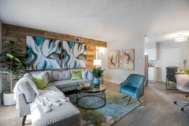 a living room with furniture and a rug