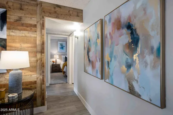 a view of hallway with livingroom and furniture