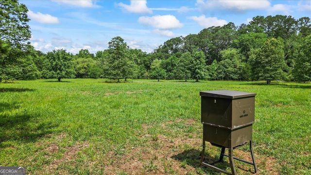 a view of a backyard with sitting area