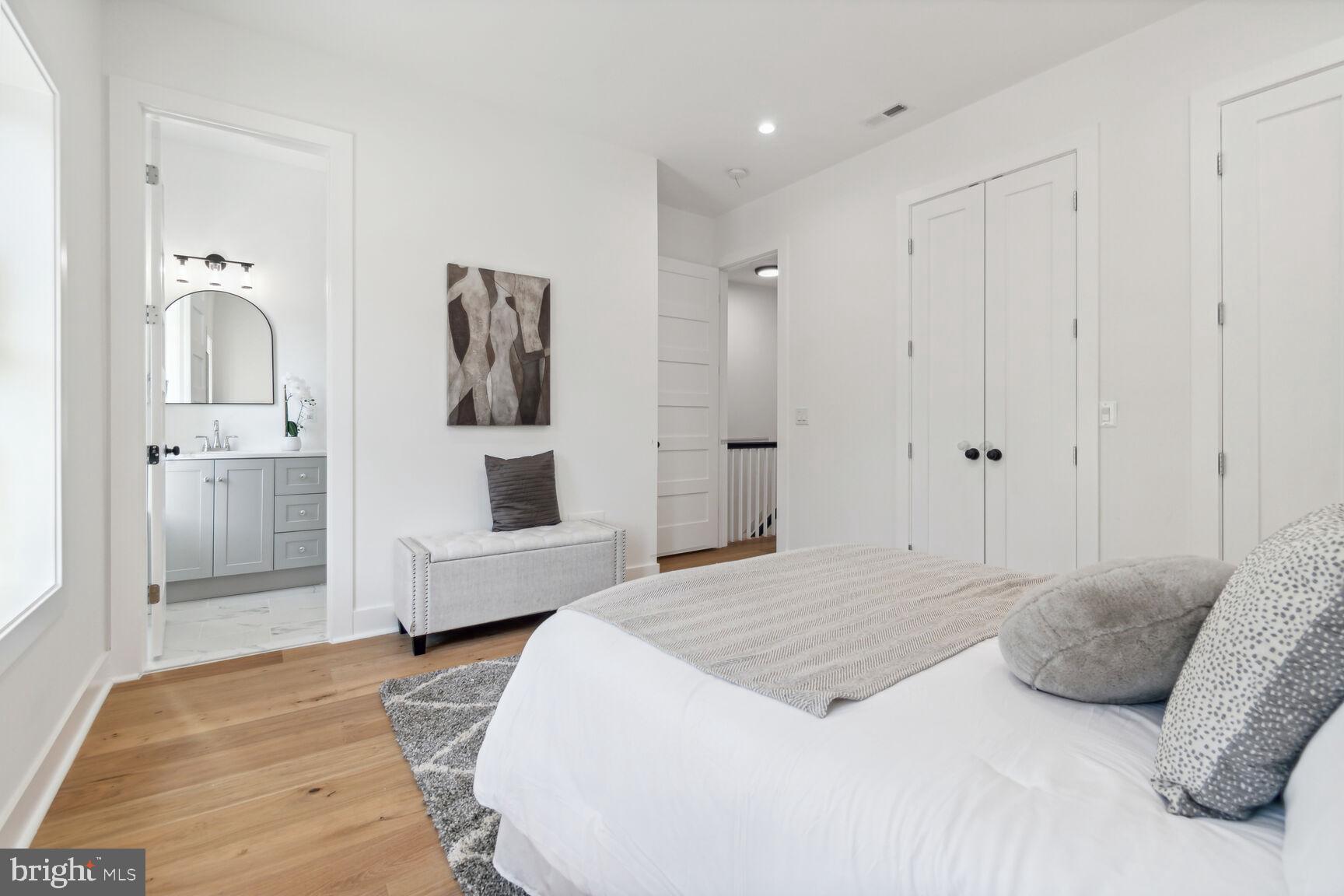 1410 A Street Northeast Washington, DC 20002 - Photo 15 of 35 a bedroom with a bed and wooden floor