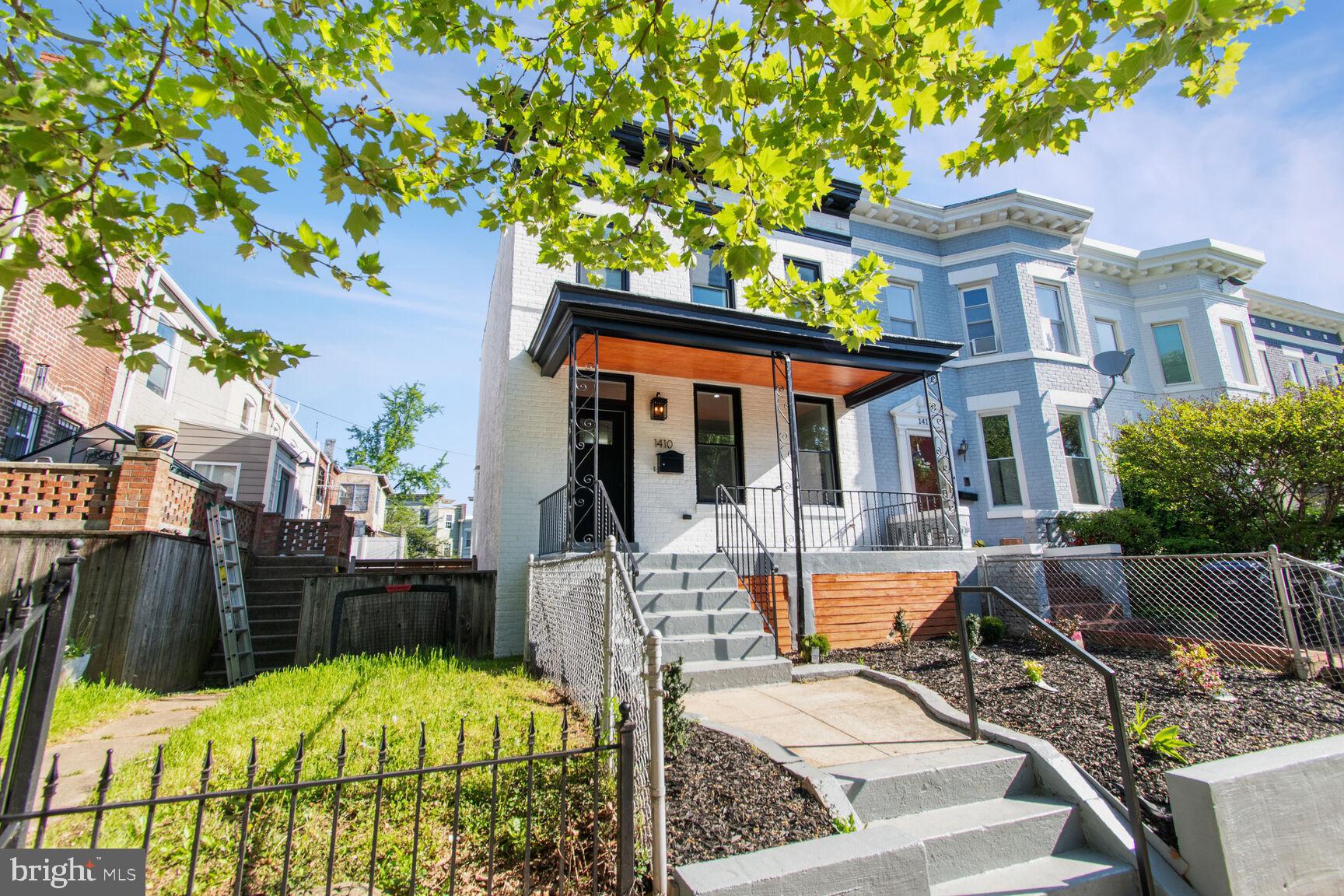 1410 A Street Northeast Washington, DC 20002 - Photo 2 of 35 a view of a patio with table and chairs potted plants and large tree