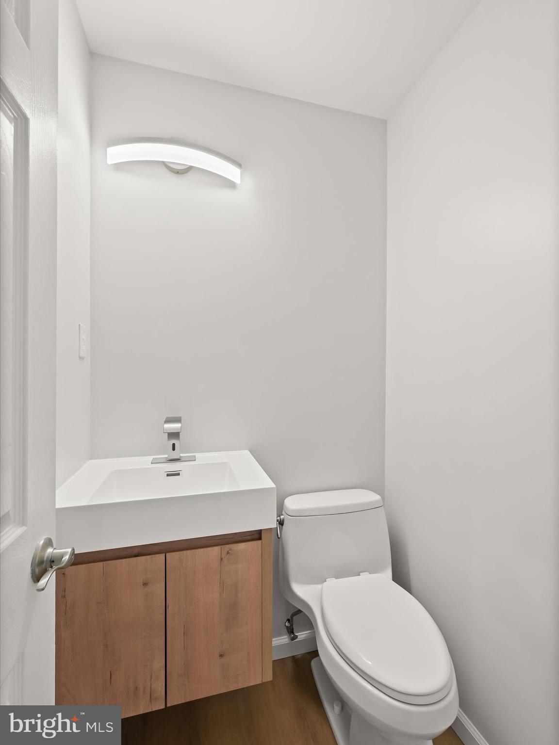8018 Martown Road Laurel, MD 20723 - Photo 32 of 64 Updated powder room with modern vanity & lighting