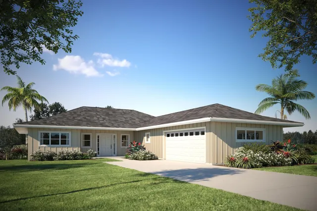 a front view of a house with a garden and yard