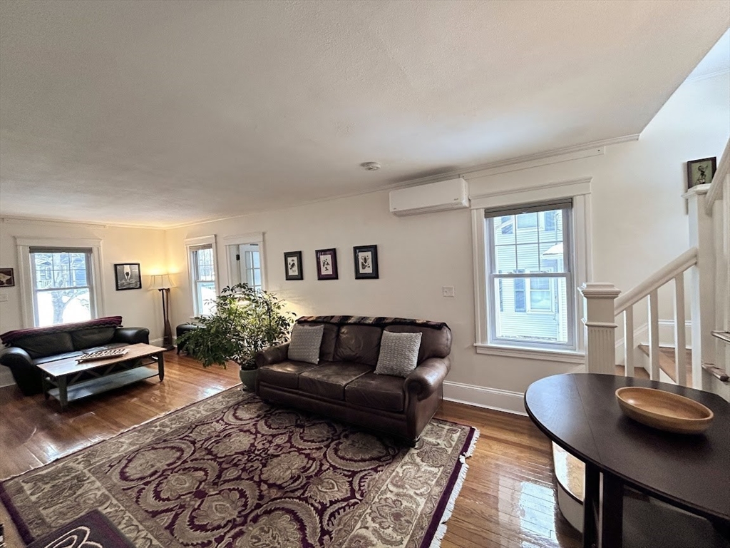 17 Longfellow Road Worcester, MA 01602 - Photo 7 of 19 a living room with furniture and wooden floor