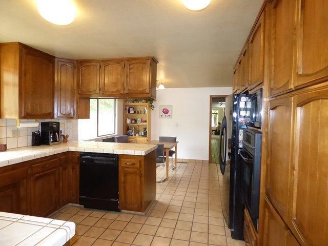 705 Missouri Flat Road Grants Pass, OR 97527 - Photo 9 of 35 Tile counter-tops, built-in microwave on