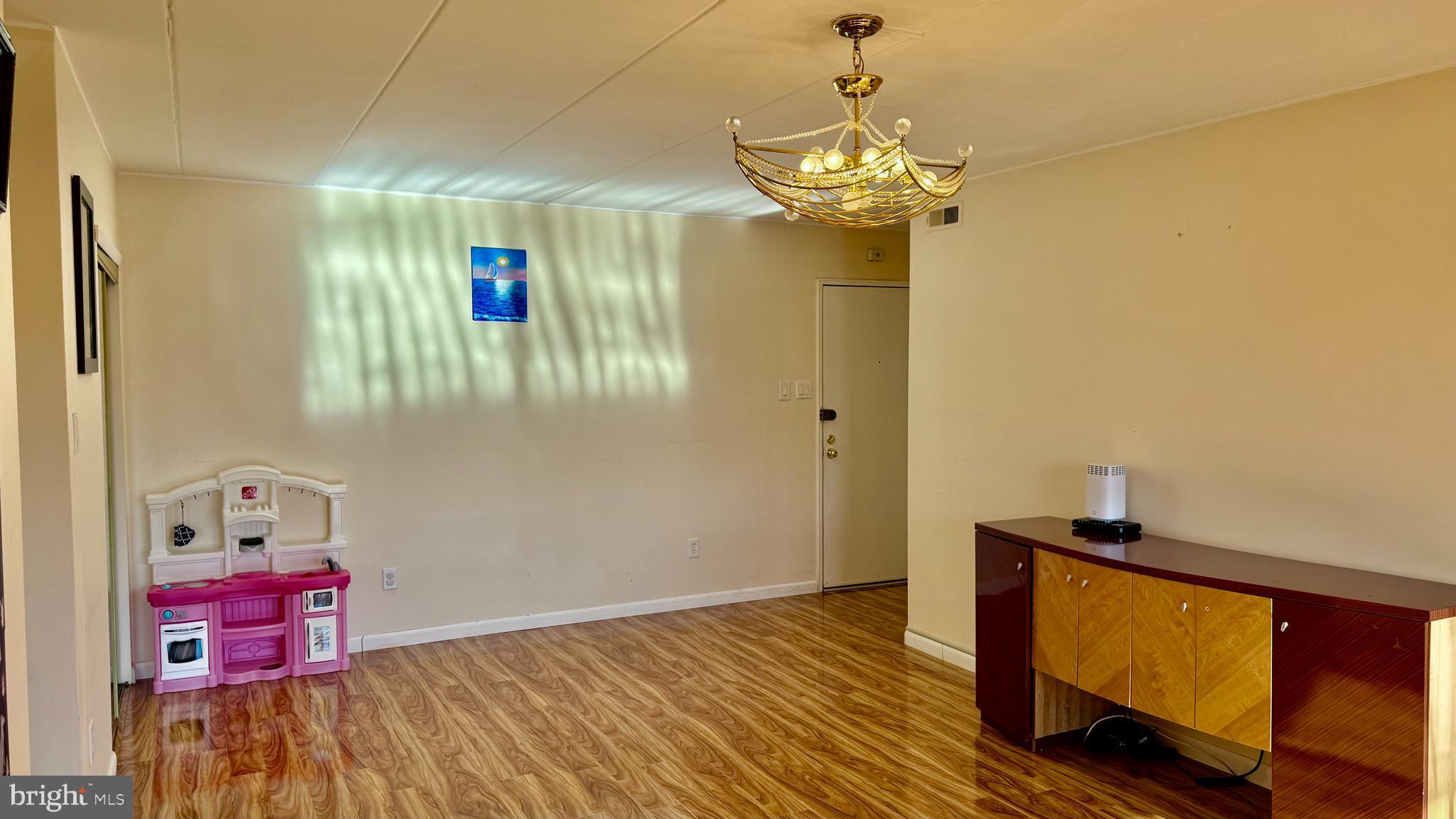 8910 Krewstown Road, Unit 118 Philadelphia, PA 19115 - Photo 11 of 15 a view of a room with wooden floor closet and windows