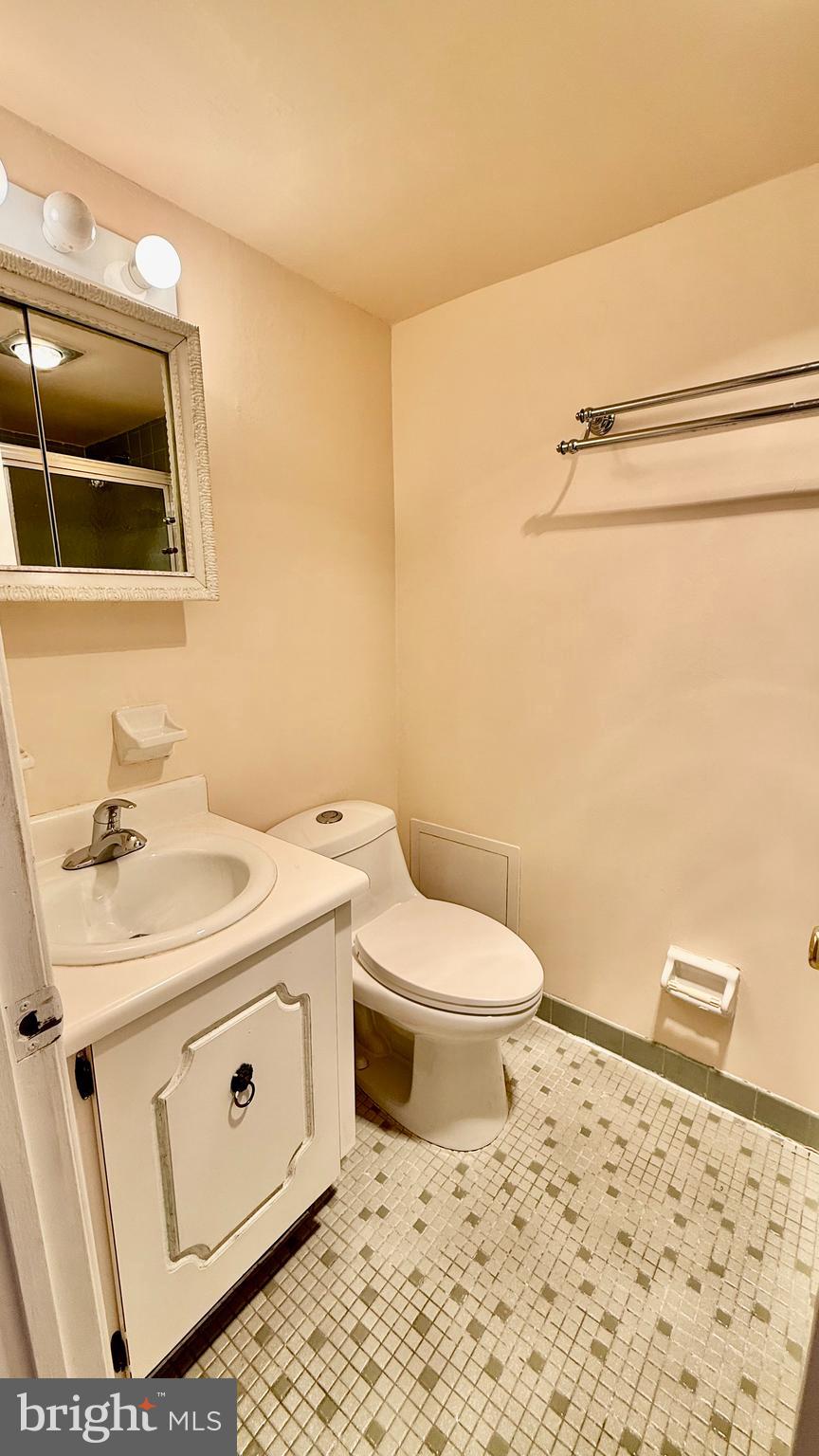 8910 Krewstown Road, Unit 118 Philadelphia, PA 19115 - Photo 4 of 15 a bathroom with a sink a toilet and shower