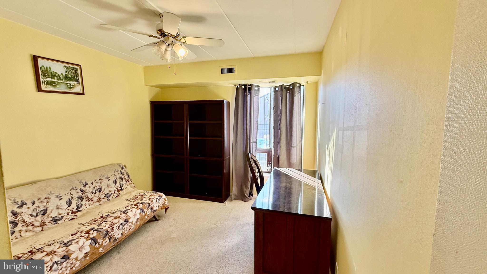 8910 Krewstown Road, Unit 118 Philadelphia, PA 19115 - Photo 5 of 15 a bedroom with a bed and a window