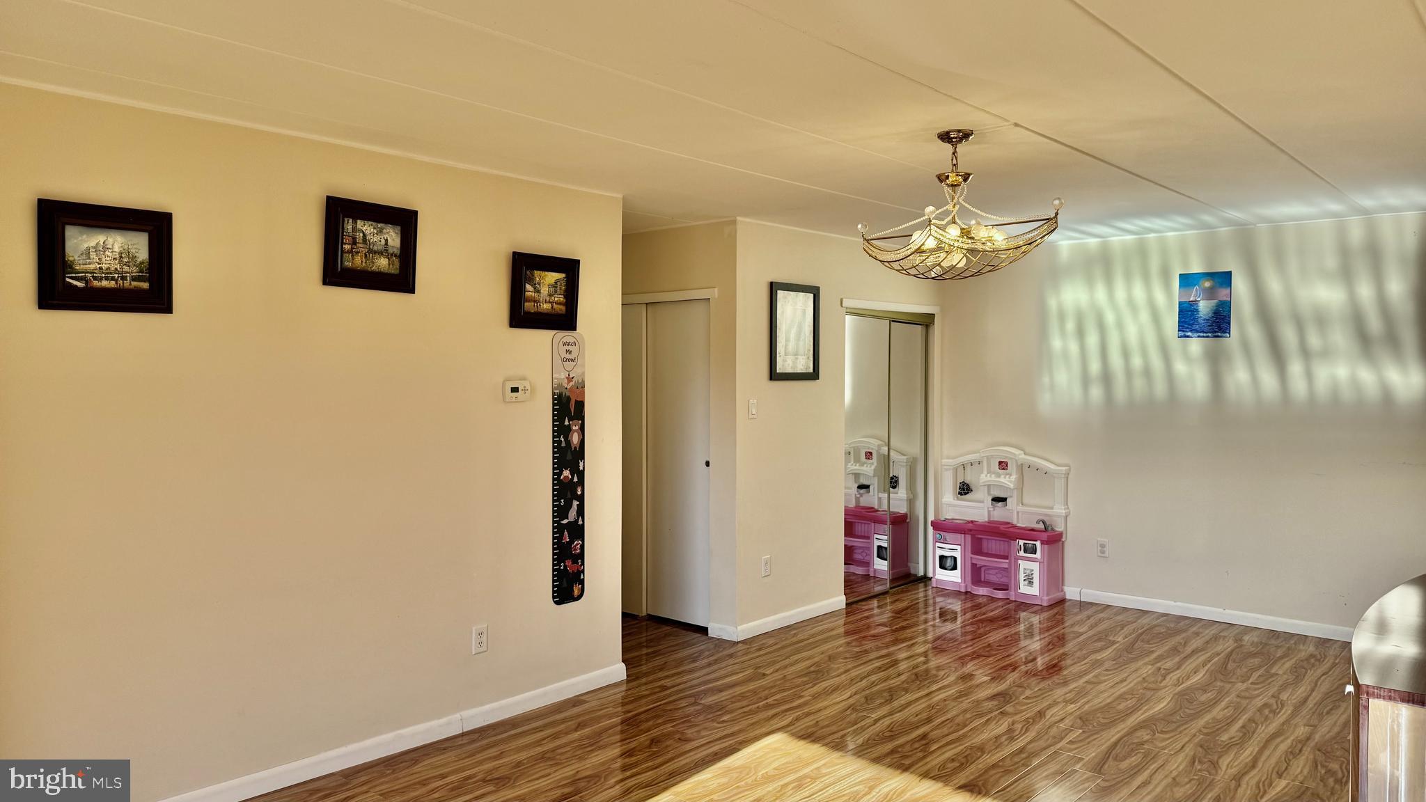 8910 Krewstown Road, Unit 118 Philadelphia, PA 19115 - Photo 10 of 15 a view of a bedroom with wooden floor and hallway