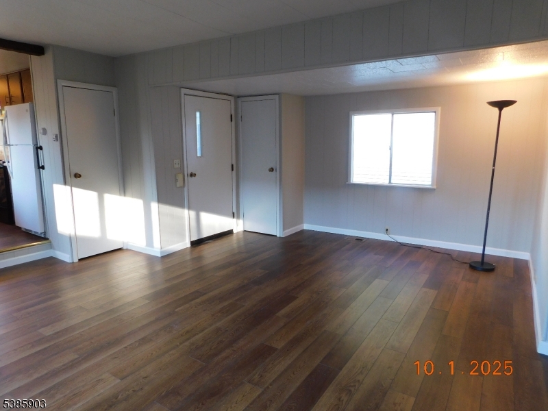 59 Back Street Oxford, NJ 07863 - Photo 12 of 25 a view of an empty room with wooden floor and a window