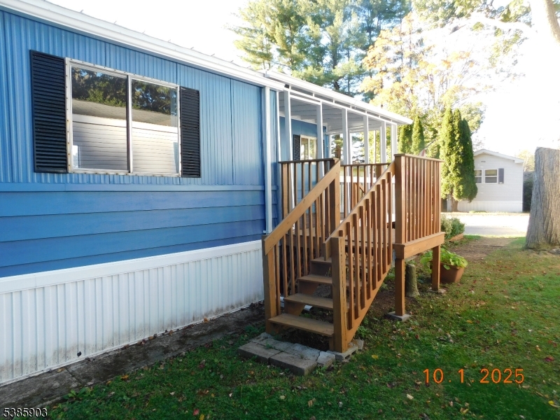 59 Back Street Oxford, NJ 07863 - Photo 3 of 25 a view of backyard with cabin and wooden fence