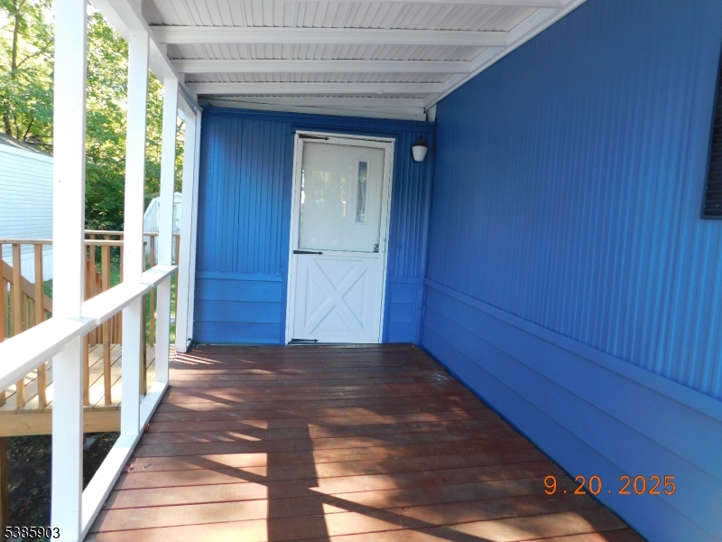 59 Back Street Oxford, NJ 07863 - Photo 8 of 25 a view of a hallway with wooden walls and stairs