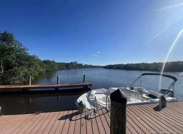 a view of a lake with a house in the background