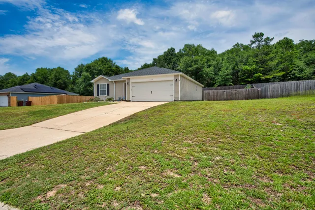 a house with garden in front of it