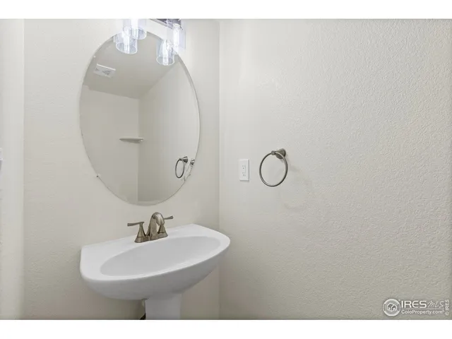a bathroom with a sink and mirror