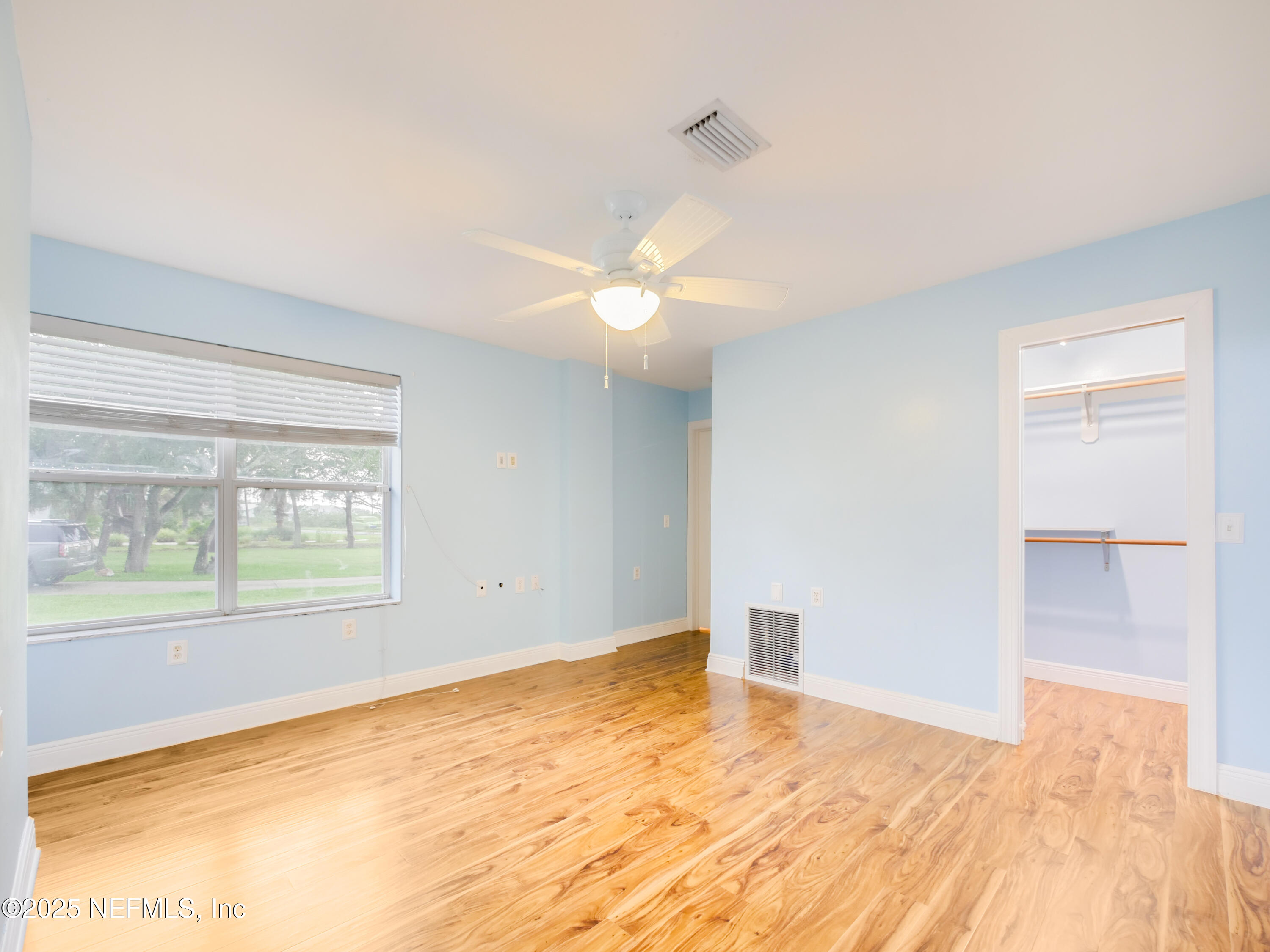 6472 Putnam Street St. Augustine, FL 32080 - Photo 15 of 26 a view of an empty room with wooden floor and a window