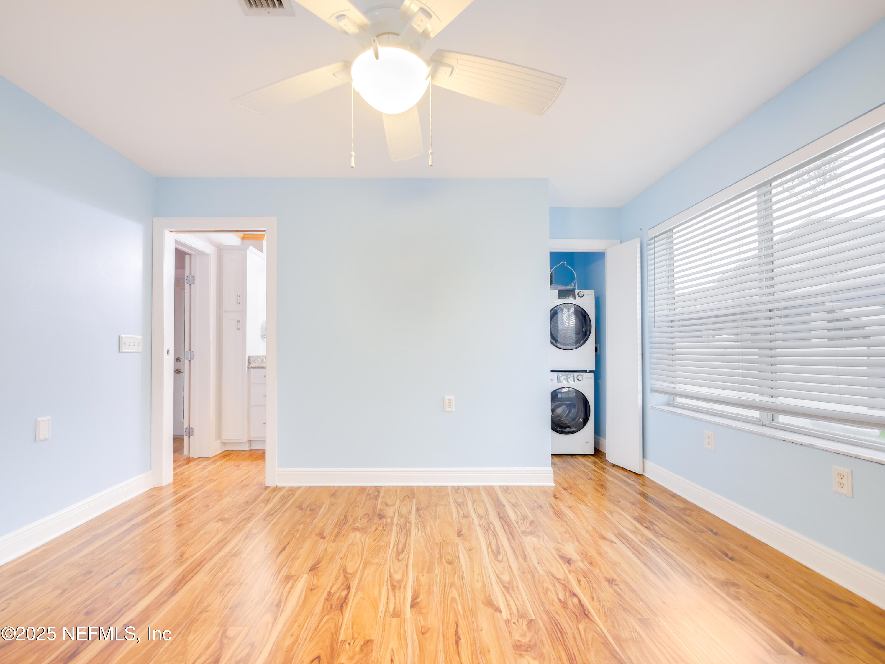6472 Putnam Street St. Augustine, FL 32080 - Photo 18 of 26 wooden floor in an empty room with a window