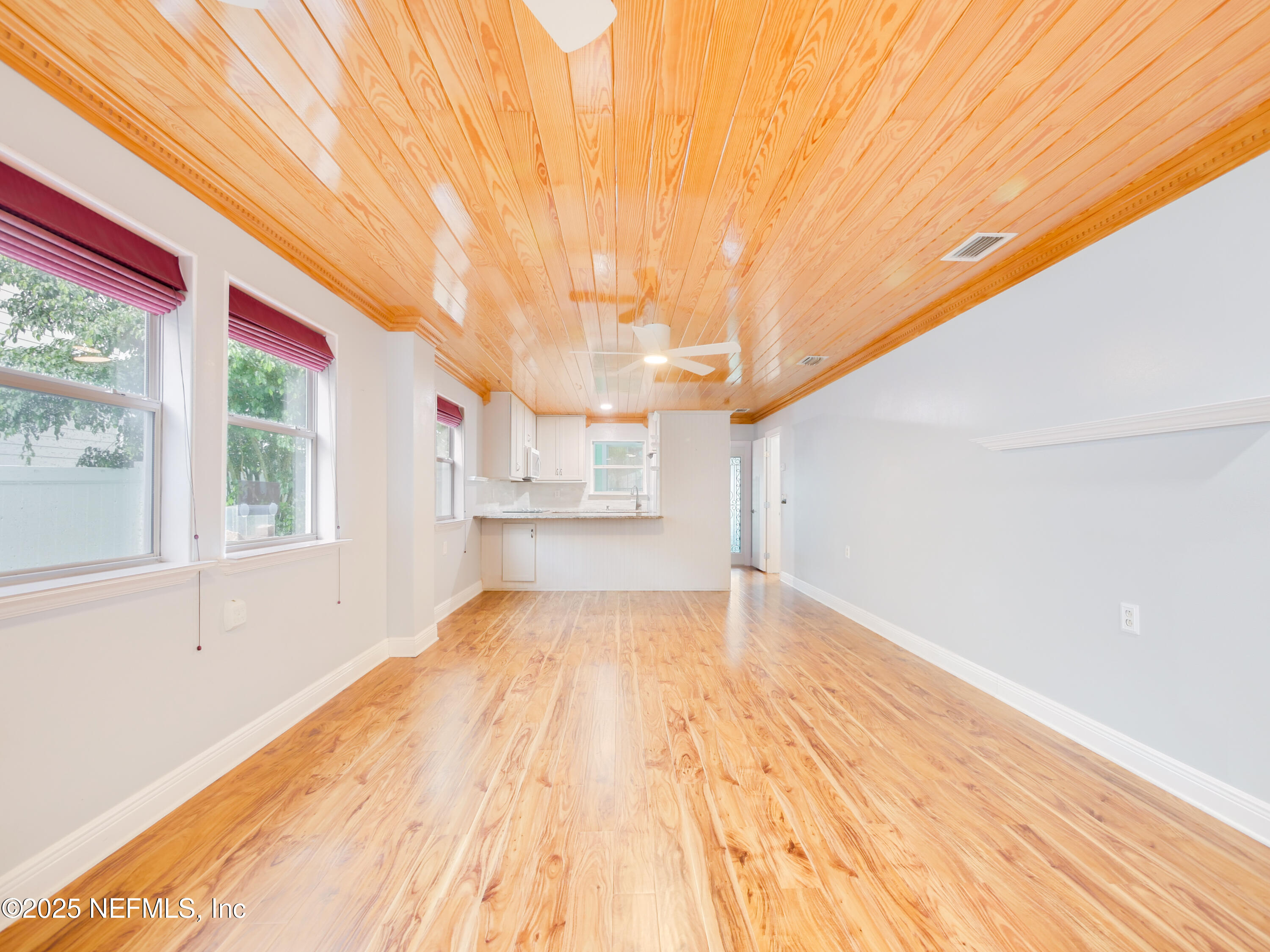 6472 Putnam Street St. Augustine, FL 32080 - Photo 2 of 26 a view of empty room with wooden floor and fan