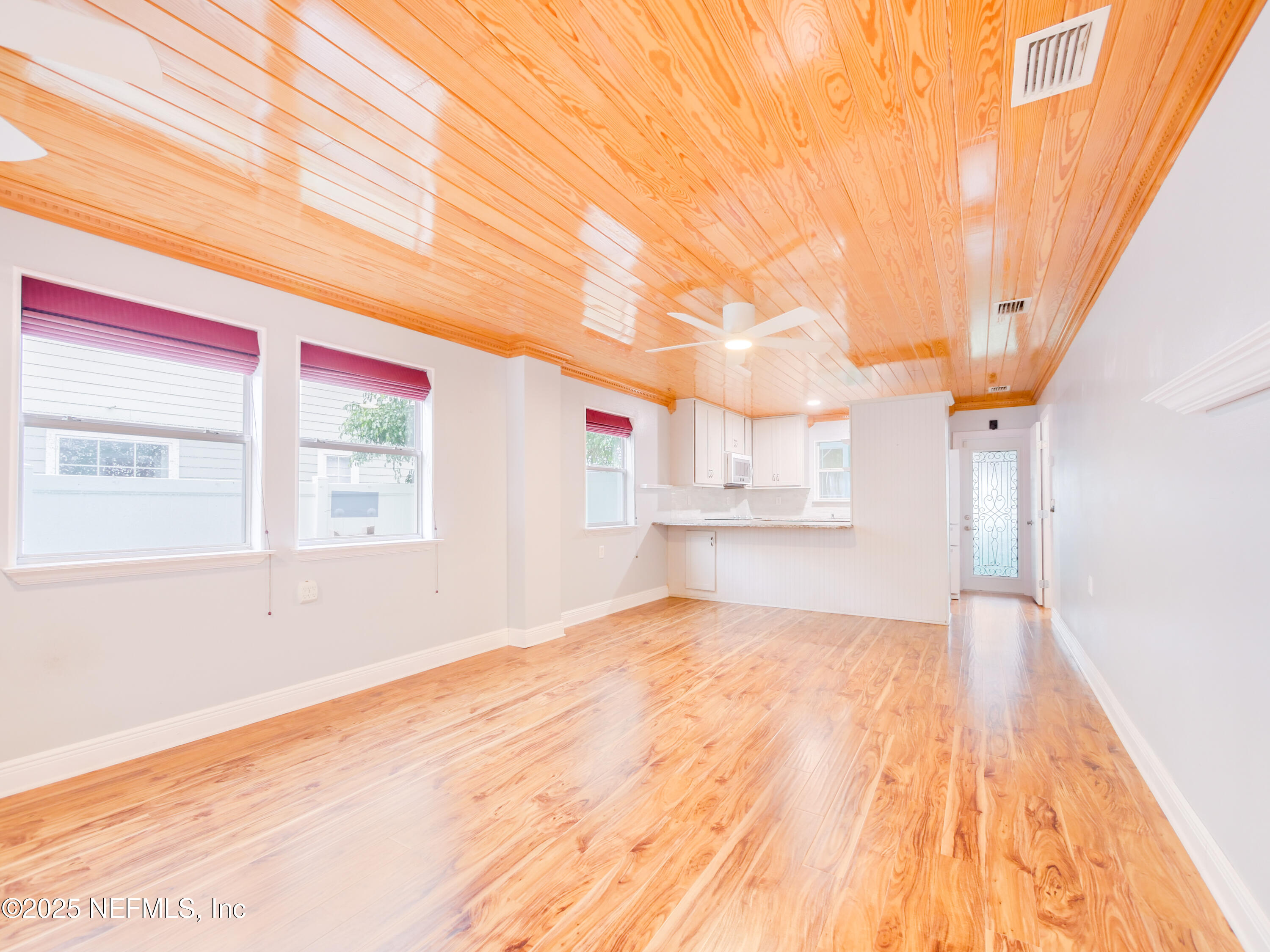 6472 Putnam Street St. Augustine, FL 32080 - Photo 3 of 26 a view of empty room with wooden floor and fan