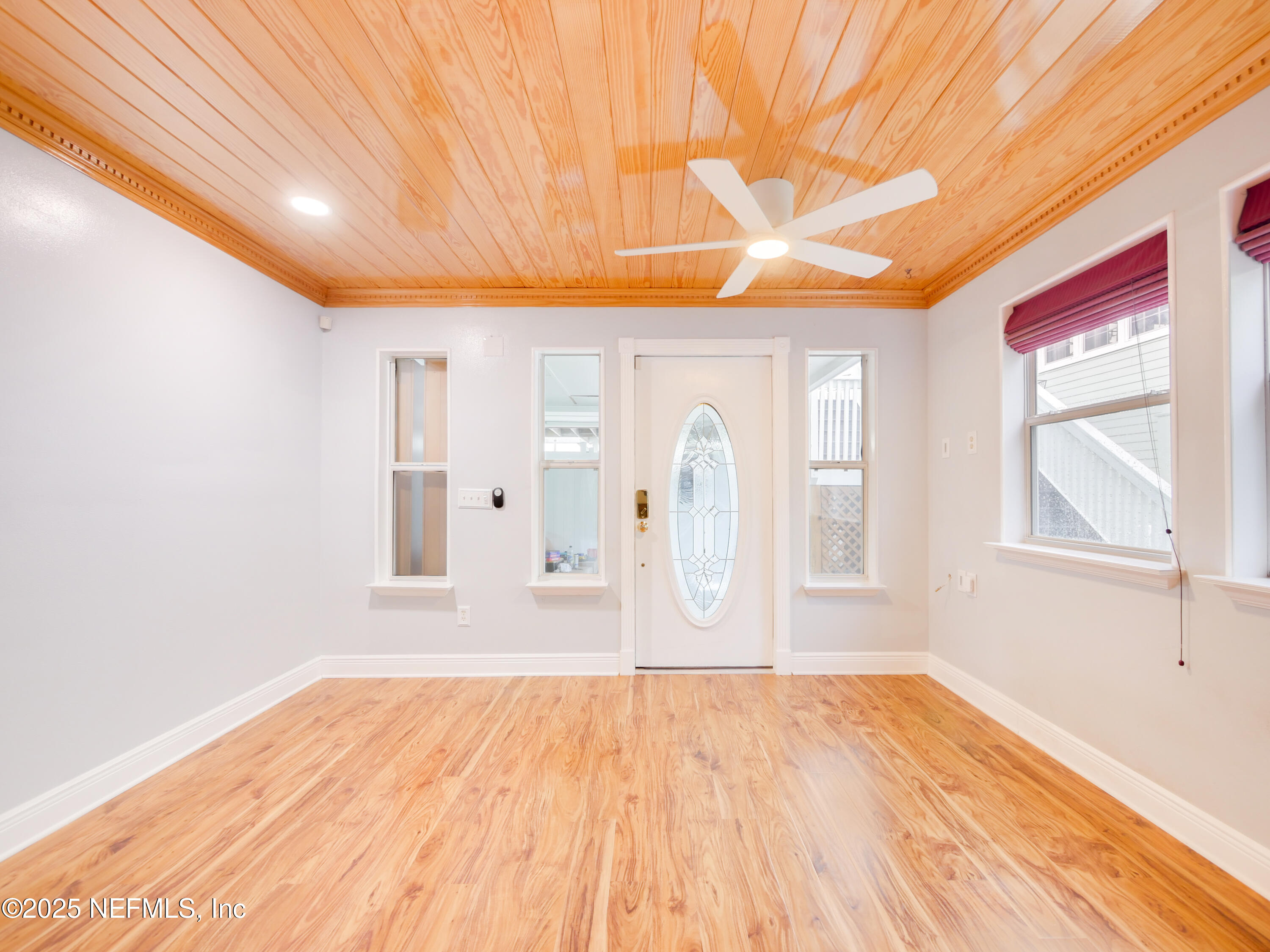6472 Putnam Street St. Augustine, FL 32080 - Photo 4 of 26 a view of empty room with wooden floor and fan