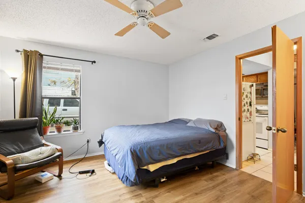 a bedroom with a bed and a window