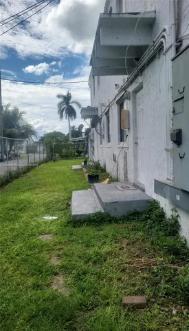 a view of a garden with a house