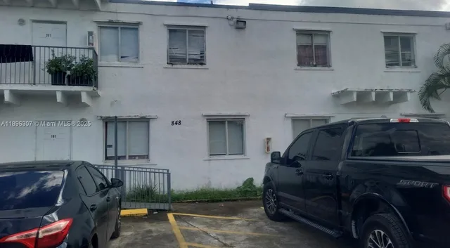 a car parked in front of a house