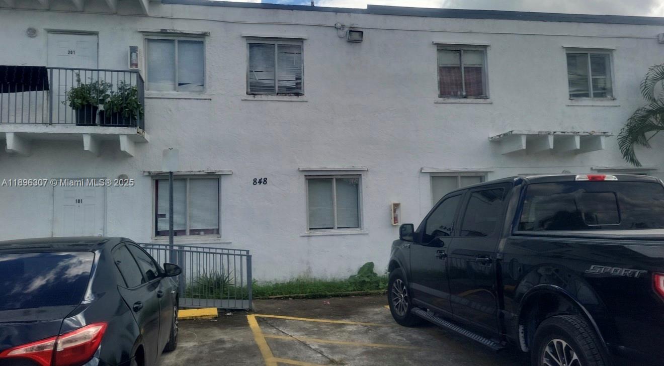 848 Southwest 5th Street, Unit 103 Homestead, FL 33030 - Photo 10 of 10 a car parked in front of a house