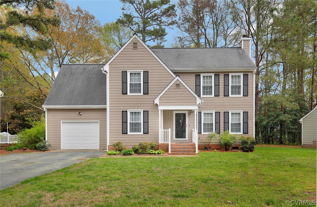 front view of a house with a yard