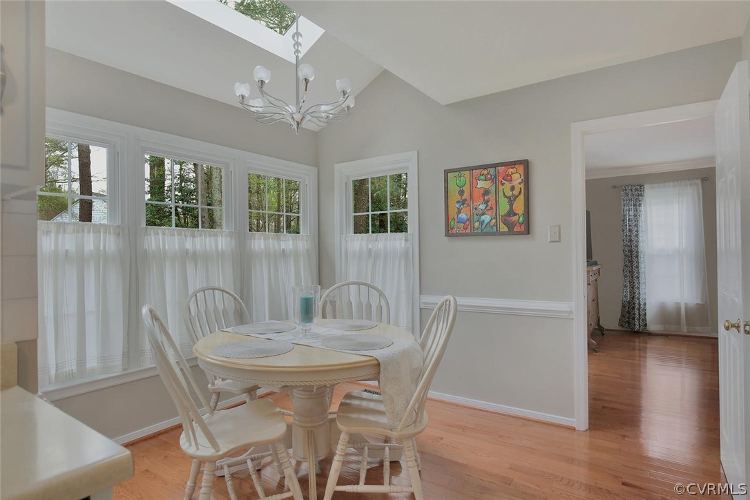 5717 Laurel Trail Road Midlothian, VA 23112 - Photo 16 of 28 a view of a dining room with furniture window and wooden floor